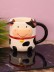 Кружка керамическая iLikeGift «Round cow», black 
