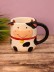 Кружка керамическая iLikeGift "Круглая корова", черная, 410мл